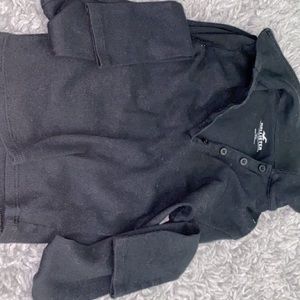 Black long sleeve v neck tee .